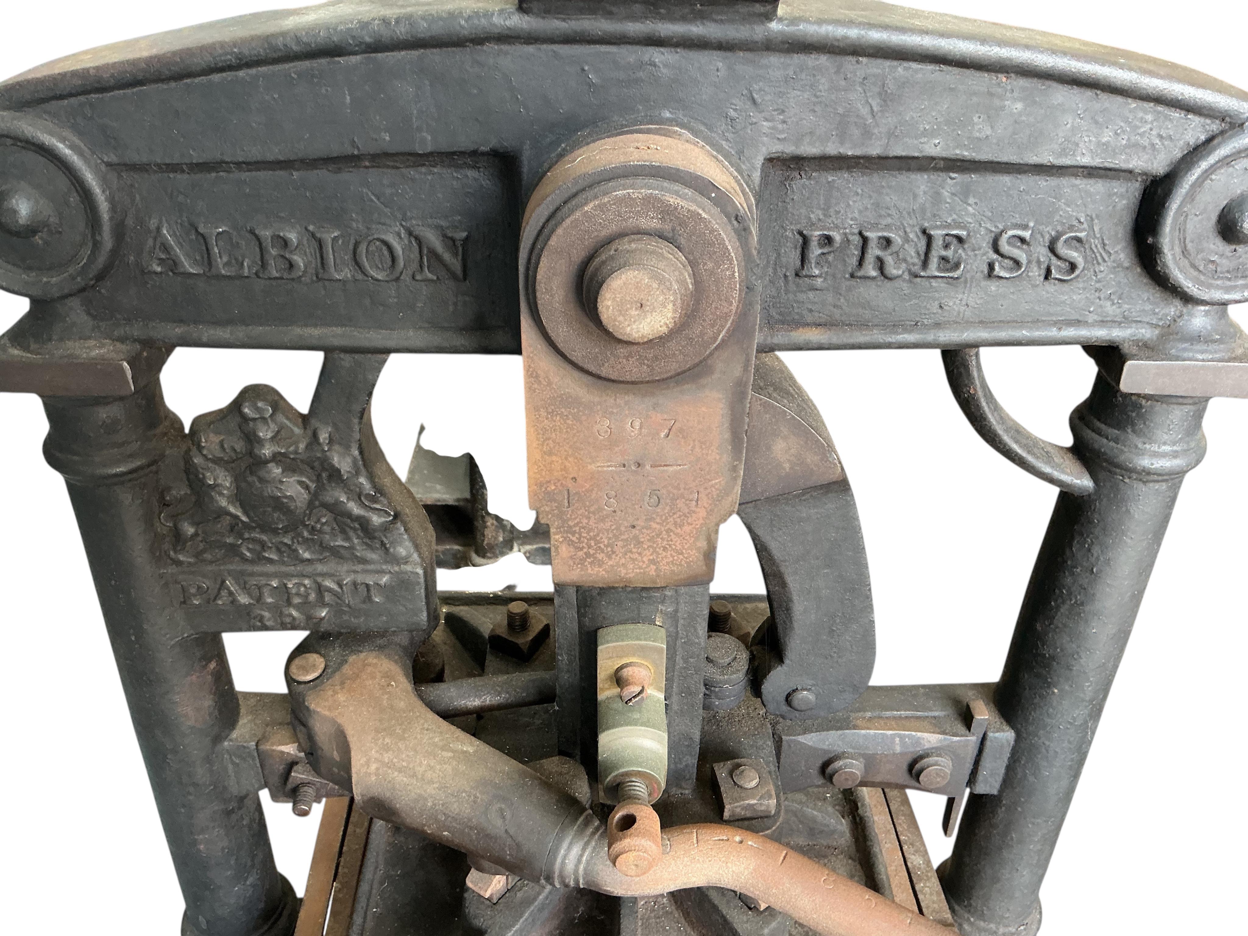 A large Victorian Albion cast iron printing press (for restoration),dated 1851, width 88cm, height 100cm. Provenance: This was the property of the printmaker and designer Jeffery Matthews.